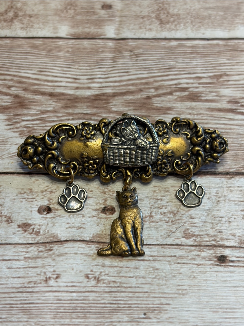 Vintage Jonette Jewelry Brass Tone Cat Brooch with Basket and Paw Charms
